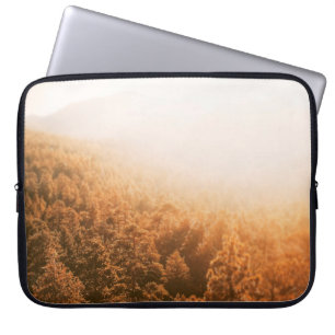 GOLDEN SUN OVER A FOREST LAPTOP SLEEVE