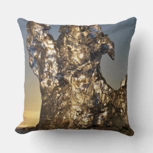 Golden sunrise seen through iceberg formation cushion