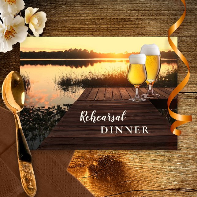 Golden Sunset Beer Rehearsal Dinner Invitation (Rehearsal Dinner invitation featuring a sunset at a lake with two beer glasses on a jetty)