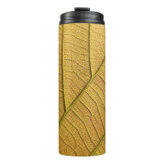 Golden yellow leaf pattern in the morning.  thermal tumbler