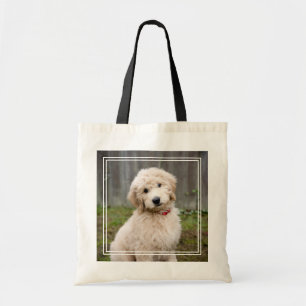 Goldendoodle Puppy Sits In Grass Tote Bag