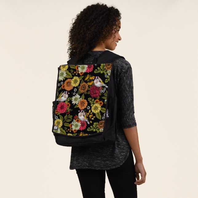 Goldfinches in the garden on black backpack (Worn)