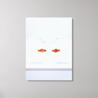 Goldfish in separate fishbowls looking face to fac canvas print