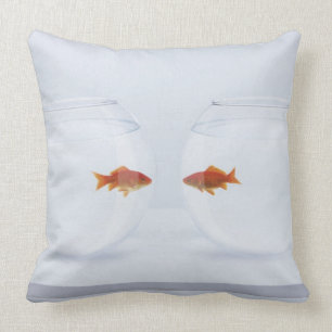 Goldfish in separate fishbowls looking face to fac cushion