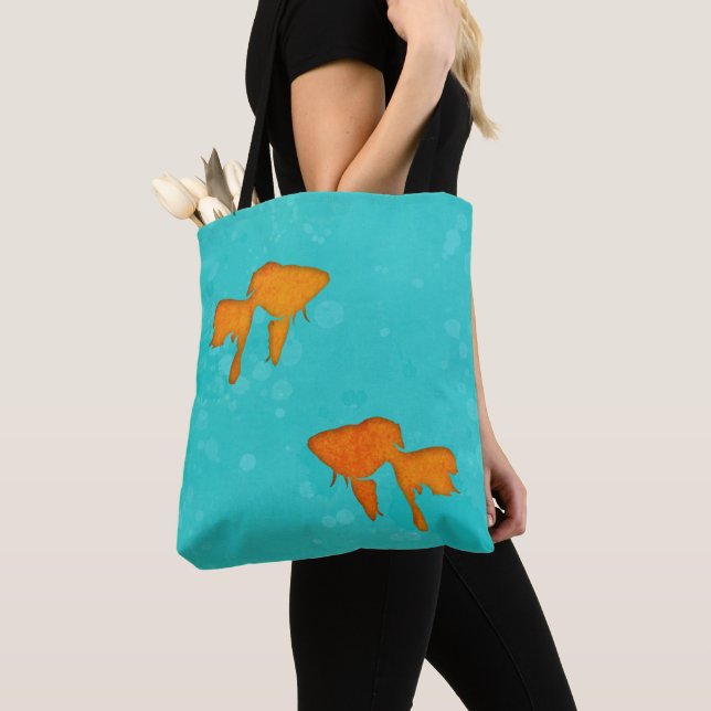 Goldfish orange silhouettes in turquoise water tote bag (Close Up)