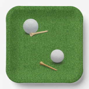 Golf ball and tee on green grass background paper plate