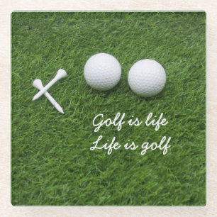 Golf ball and tees are on green grass Golf is life Glass Coaster
