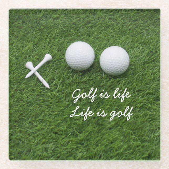Golf ball and tees are on green grass Golf is life Glass Coaster (Front)