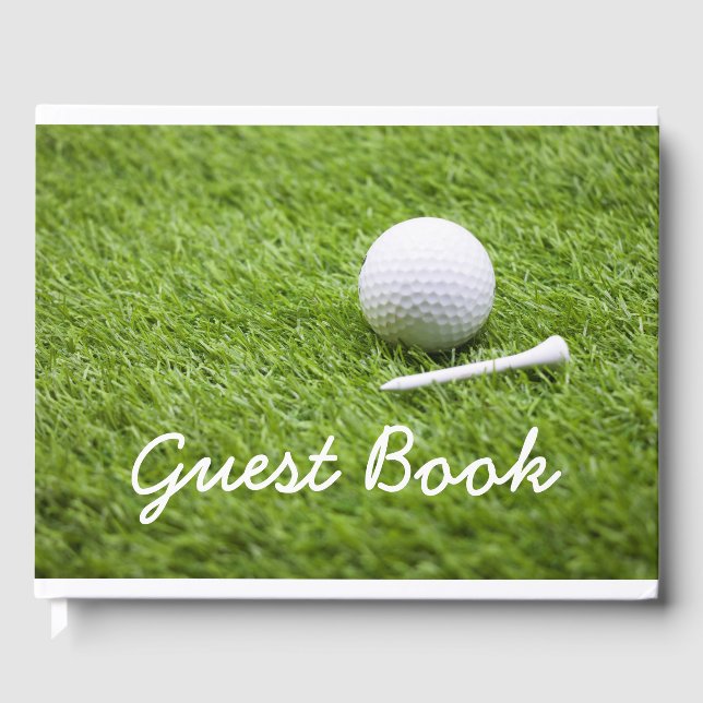 Golf ball and white tee are on green grass golfer guest book (Front)