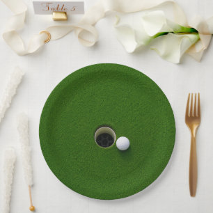 Golf Ball Next to Hole on Green Grass Golf Course Paper Plate