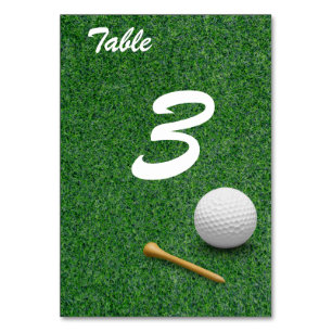 Golf ball on green grass for golfer party  table number