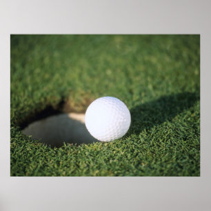 Golf Ball on the edge of hole Poster