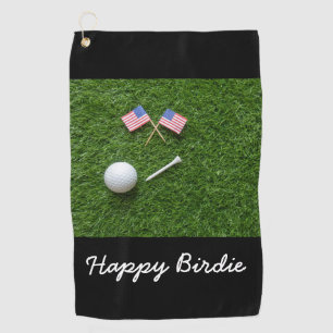 Golf ball tee and flag of America U.S.A. on green Towel