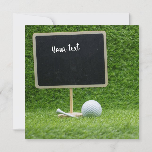 Golf ball with blank chalkboard on green grass (Front)
