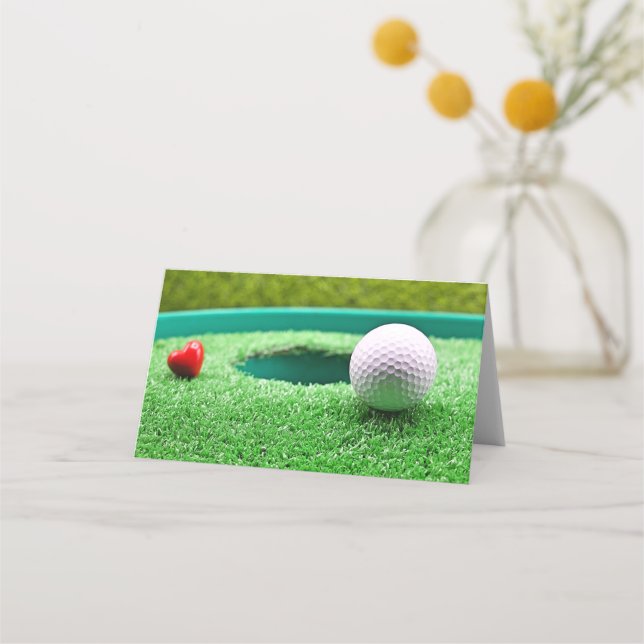 Golf ball with heart next to the hole place card (Front)
