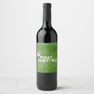 Golf ball with Merry Christmas to golfer on green Wine Label