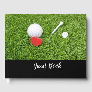 Golf ball with tee and red heart on green wedding guest book