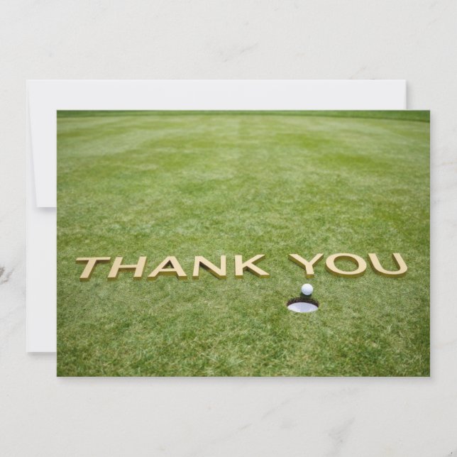 Golf ball with text Thank you on green grass Card (Front)
