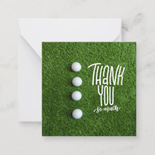 Golf ball with thank you so much on green grass card