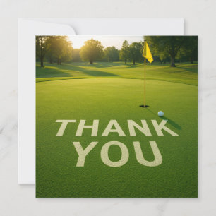 Golf ball with word thank you on putting green card