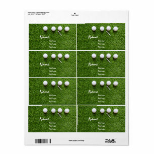 Golf balls and tee on green grass