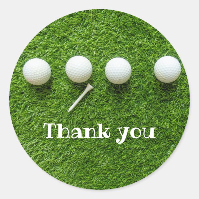 Golf balls are on green grass thank you classic round sticker (Front)