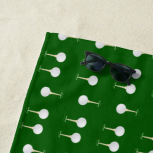 Golf balls pattern on green beach towel
