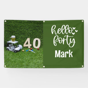 Golf cart is on green grass 40th birthday banner