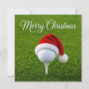 Golf Christmas with Santa hat on green grass Card
