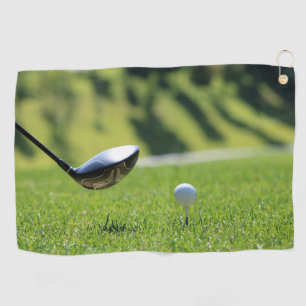 Golf club and ball on a tee in grass Best Towel