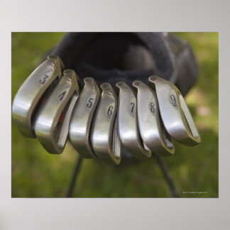 Golf club heads in a bag. Three through nine Poster