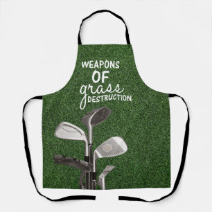 Golf Clubs are on green grass Apron