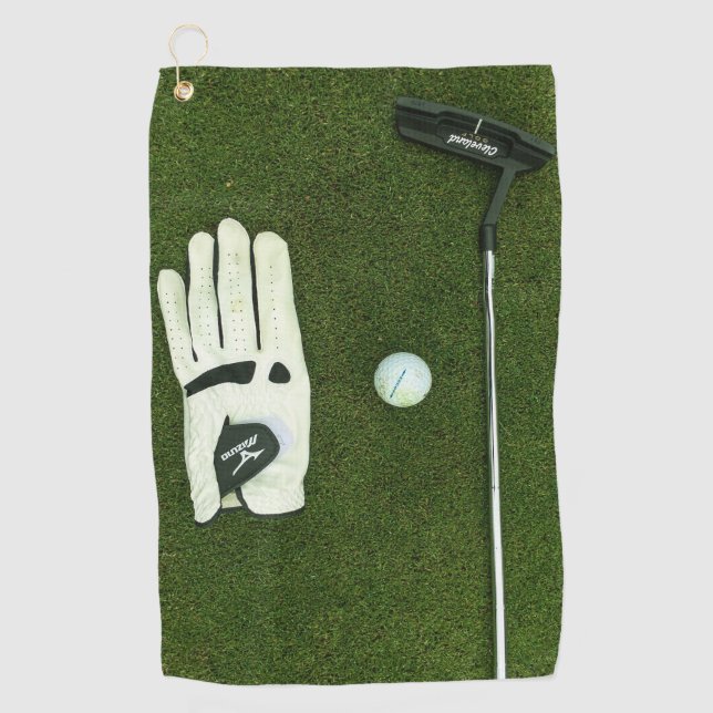 Golf glove and ball on grass Golf Towels (Front)