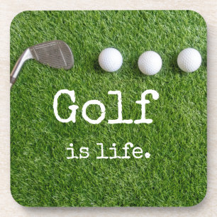 Golf is life with golf balls are on green grass coaster