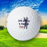 Golfer Driving Hard at 70 Golf Balls<br><div class="desc">This is a fun birthday present for the man who is turning the big 70! A grey silhouette golfer in full swing is featured on one side of this custom golf ball. Red and blue text says "Still driving it HARD at 70". Definitely will be a favourite on the course!...</div>