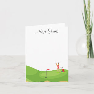 Golfer Woman is on green grass in golf course Note Card