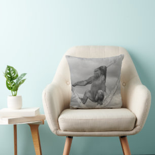 Gorilla Posing On A Tree Cushion