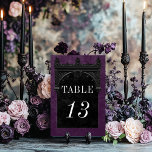 Gothic Black Raven & Black Arch Purple Wedding Table Number<br><div class="desc">Transport your guests to a world of dark, enchanting elegance with our vintage gothic wedding table number card. The deep, aged royal purple background sets the stage for a striking contrast, as bold white text emerges from intricate black text boxes. At the pinnacle of this invitation, a three-dimensional gothic border...</div>