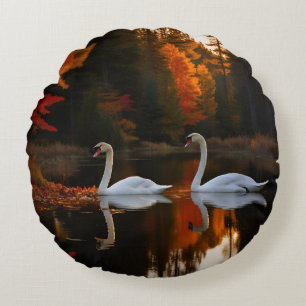 Graceful White Swans Gliding Across Autumn Pond Round Cushion