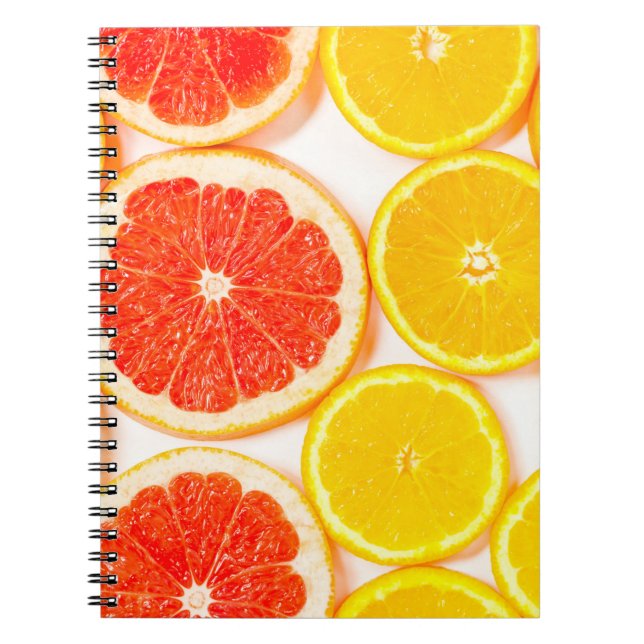Gradient colour citrus slices on white backgrounda notebook (Front)