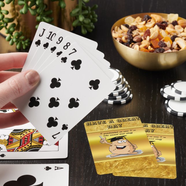 Graduation potato character with a degree playing cards (In Situ)