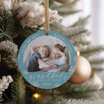 Grandkids Make Life Grand Photo Ceramic Tree Decoration<br><div class="desc">Create a sweet gift for a beloved grandma or grandpa with this beautiful ceramic photo ornament. "Grandkids make life grand" appears along the bottom with white snowflake accents. Personalise with the year beneath,  and the grandchildren's names curving across the top. Add a second photo to the back.</div>
