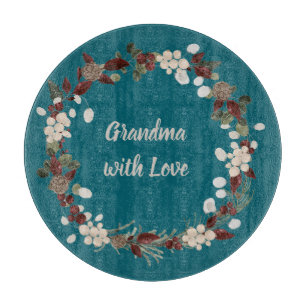 Grandma Christmas wreath on a rich teal  Cutting Board