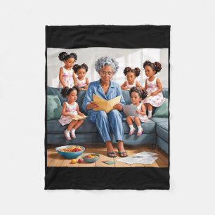 Grandma reading story to granddaughters family fleece blanket