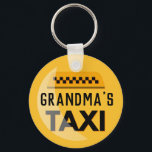 Grandma's Taxi Keychain<br><div class="desc">Grandma busy driving the grandkids around enough to warrant recognition as a taxi service? This is the perfect,  funny gift for her. Yellow and black taxi-style emblem with words,  "Grandma's Taxi" in black" features digitally rendered highlight and chequered pattern icon above title.</div>