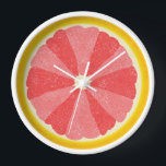 Grapefruit Slice Pop Art Minimalist Kitchen Food Wall Clock<br><div class="desc">This colourful grapefruit clock is perfect for your kitchen or breakfast nook decor. It shows a sliced open image of a grapefruit citrus fruit half with 12 slices in alternating shades of pink, so you can tell time without numbers. This unusual design has a textured look - and sort of...</div>