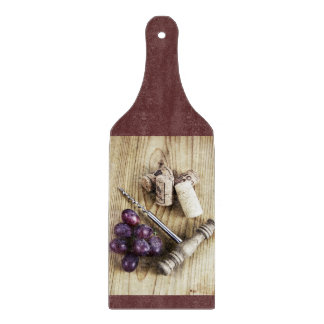 Grapes, corks and bottle opener cutting board