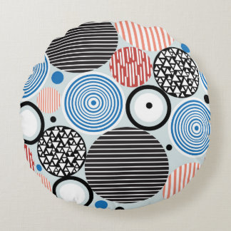 graphic pattern of multicolored circles of differe round cushion