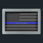 Graphic Thin Blue Line Personalised Black US Flag Belt Buckle<br><div class="desc">A Thin Blue Line symbolic Grey US flag design graphic belt buckle. A great gift idea for gatherings, memorial celebrations and remembrance occasions. Personalise it with your text. Here's a fine line up of custom blue line design styles available on embroidered casual baseball caps for everyone. Use the "Ask this...</div>