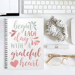 Grateful Heart | Hand Lettered Typography Quote Notebook<br><div class="desc">Spread an attitude of gratitude. Our handwritten typography notebook design features the quote "begin each day with a grateful heart" in pastel hued hand lettered calligraphy script adorned with swashes and a heart illustration.</div>